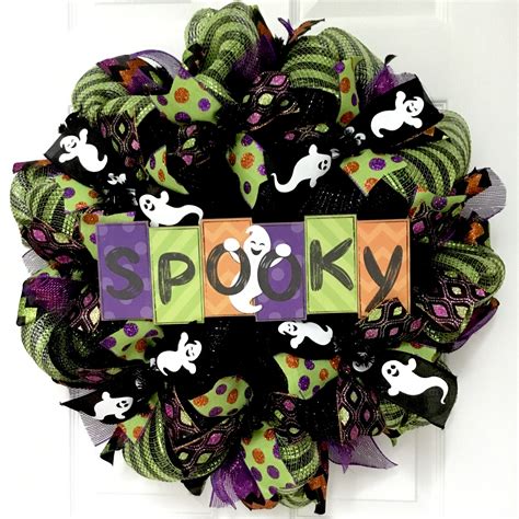 The Holiday Aisle® Halloween Wreath With Spooky Written In Colorful