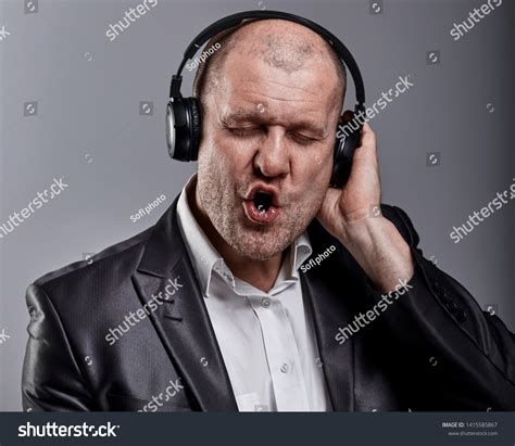 Beautiful Emotional Dancing Singing Bald Man Stock Photo