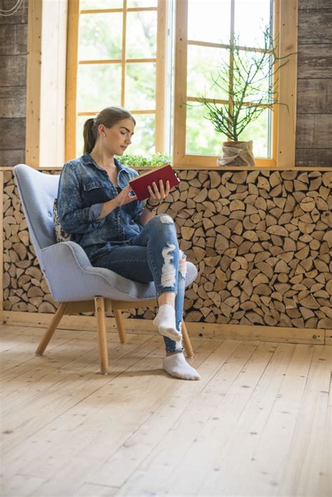 Stylish Woman Sitting On Chair And Reading Book Free Photo Sitting Pose