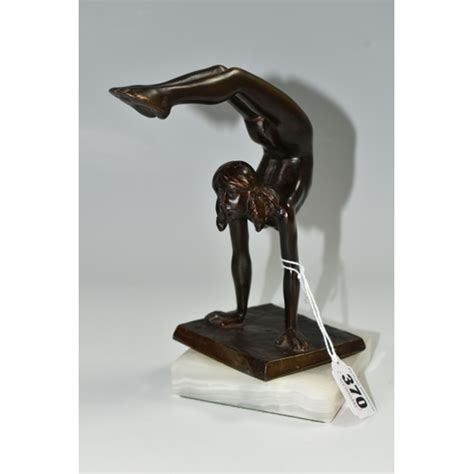 An Art Deco Style Bronze Figure Of A Nude Female Acrobat After Carl