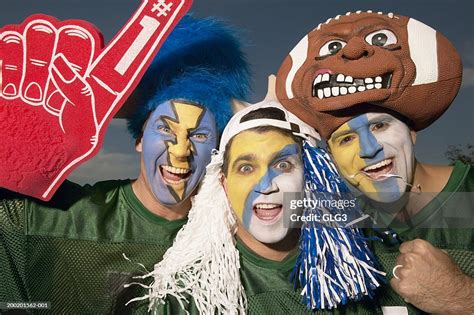 Three Male Football Fans Wearing Face Paint Gesturing High-Res Stock Photo - Getty Images