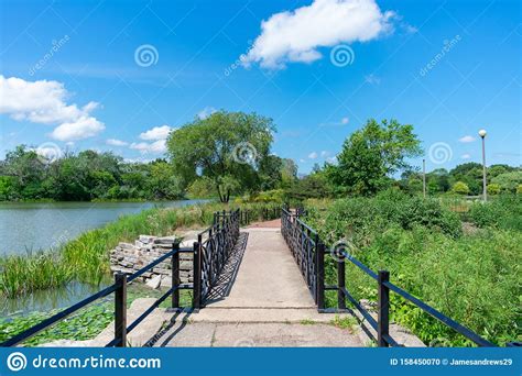 Bridge On The Shoreline Of The Humboldt Park Lagoon In Chicago Stock