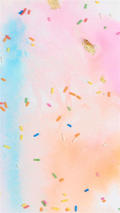 Colorful Sprinkles And Confetti On A Pink Blue And Yellow Background