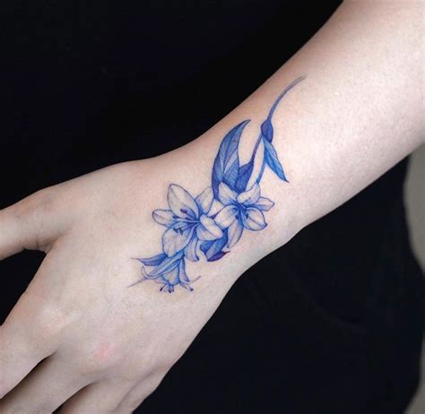 Zeetattoo on Instagram: “Blue lily💙 @zeetattoo . . . #lilytattoo # ...