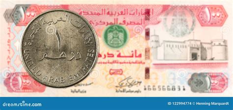 1 Dirham Coin Against 100 United Arab Emirates Dirham Bank Note Stock ...