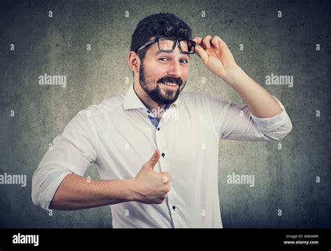 Happy Man Wearing Glasses Giving Thumbs Up Gesture With Hand Taking Off