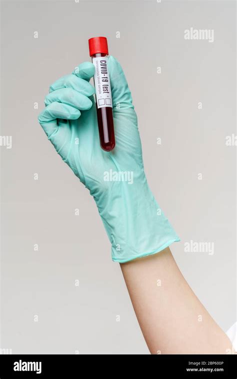 Hand In Latex Glove Holding Blood In Test Tube Close Up Stock Photo Alamy