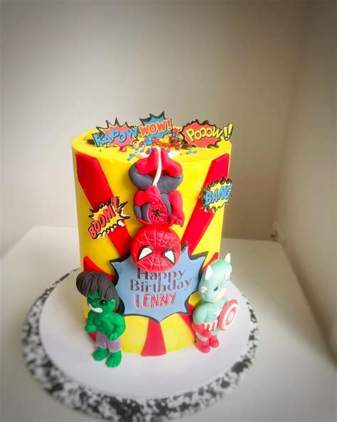 The Birthday Cake Is Decorated With Cartoon Characters