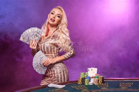 Blonde Woman With A Perfect Hairstyle And Bright Make Up Is Posing With Playing Cards In Her