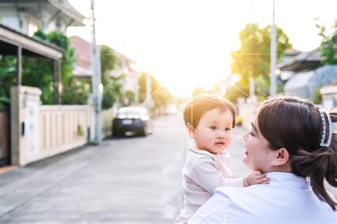 premium photo asian newborn baby kid eye contact  mom cuteness