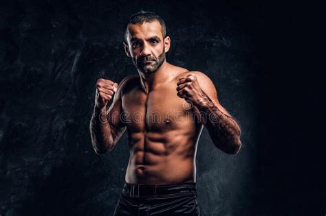 Portrait Of A Brutal Professional Fighter With Naked Torso Posing For A Camera Stock Photo