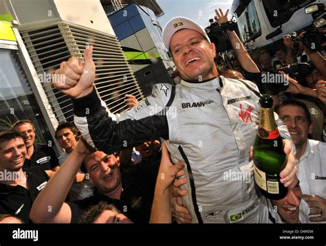 Brazilian Rubens Barrichello C Celebrates With Brawn Team Members