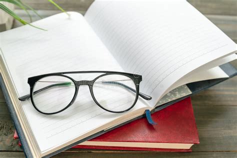 Reading Glasses Put On Hardcover Book Beside The Window Stock Image Image Of Eyeglass Concept