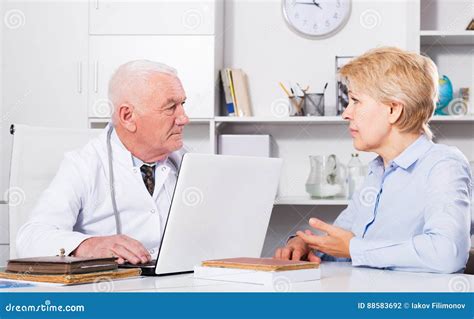 Woman On Consultation With Doctor Stock Photo Image Of Indoors