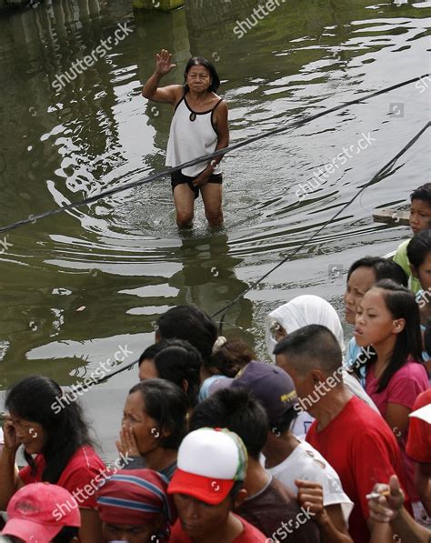 Filipino Woman Wades Through Floodwaters Receive Editorial Stock Photo