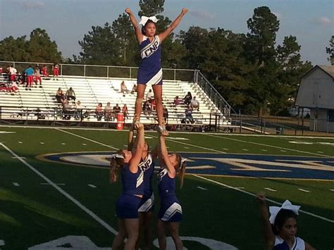 the cheerleaders are doing stunts on the field