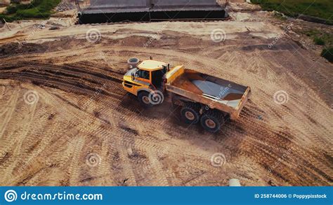 Active Work On A Road Building Site A Dumper Truck With Earth In A