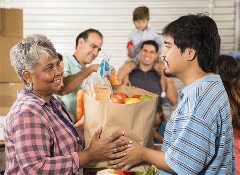 People Giving Food To Others