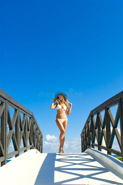 Woman In White Bikini Sitting Near Infinity Pool Stock Image Image Of