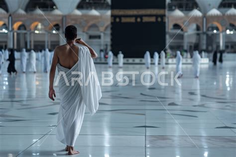 Performing Hajj And Umrah Rituals A Close Up Photo Of A Young Saudi