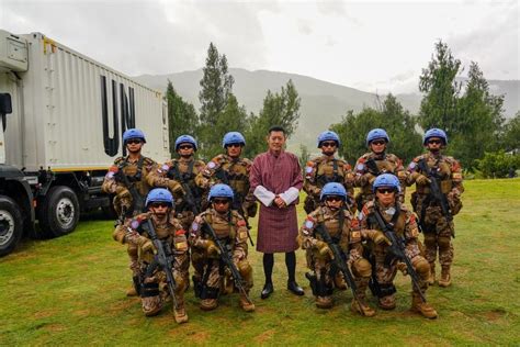 King of Bhutan posing with a Royal Bhutan Army UN Peacekeeping ...