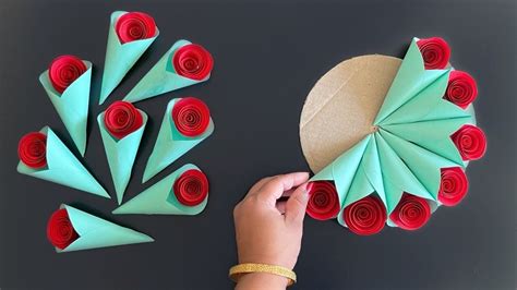 Someone Is Making A Flower Arrangement Out Of Paper