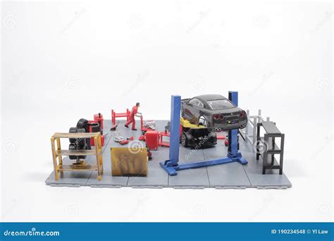 A Mini Mechanics Repairing Toy Carconcept Of The Workshop Stock Photo