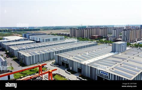 --FILE--Aerial view of factory buildings in Lingang area, Shanghai, China, 8 June 2019. China's ...