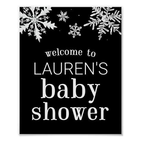 A Black And White Sign With Snowflakes On It That Says Welcome To