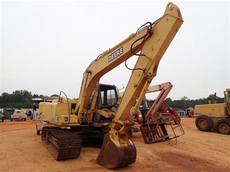 JOHN DEERE 120 Excavator - J.M. Wood Auction Company, Inc.