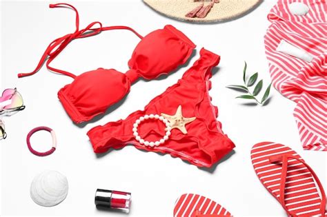 Premium Photo Red Bikini And Beach Accessories On White Background
