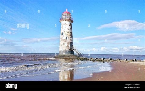 Talacre beach with old lighthouse and sea Stock Photo - Alamy