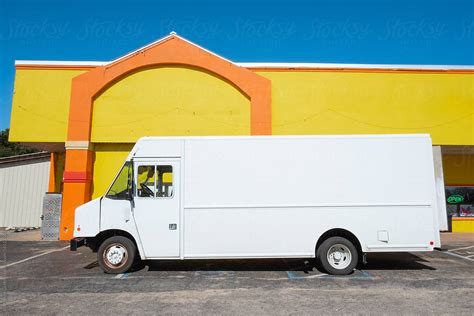 Delivery Truck Parked Outside Colorful Store By Stocksy Contributor