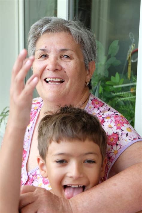 Grandson And His Grandmother Having Fun Together Stock Photo Image Of Happy Mature