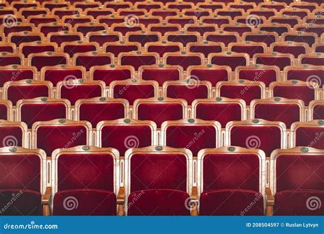 Row of red seats theatre stock image. Image of public - 208504597