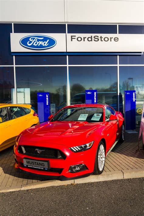 Ford Mustang Car in Front of Ford Motor Company Dealership Building ...