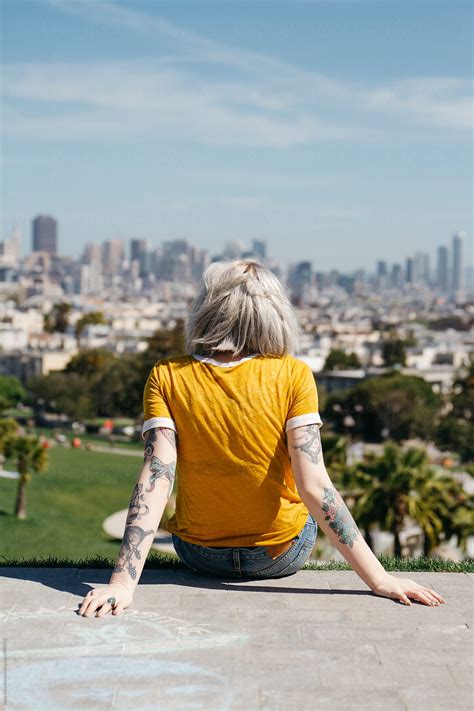 Young Woman In San Francisco Park Looking Out Over City Buildings By Stocksy Contributor