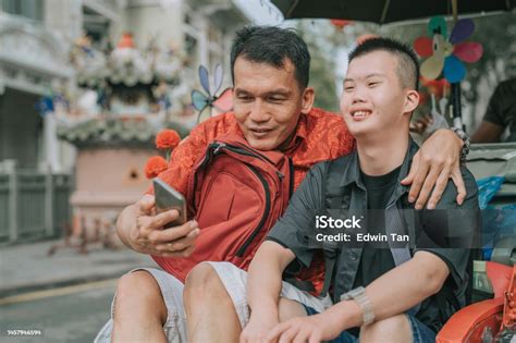 Asian Chinese Down Syndrome Young Man Enjoying Rickshaw Ride In Penang ...