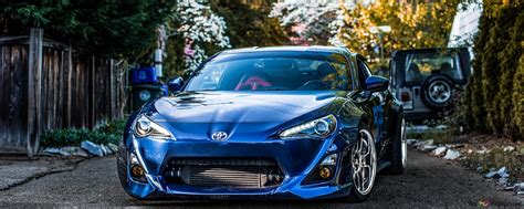 blue toyota supra parking  road  trees  wallpaper