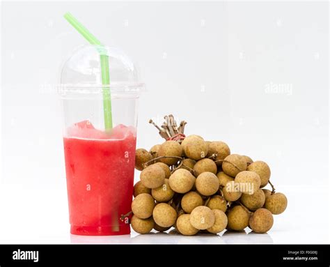 Longan Juice And Longan Fruit On A White Table Background Stock Photo