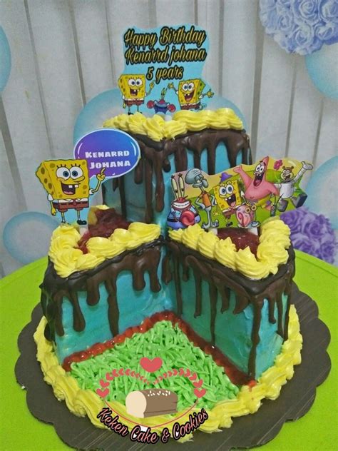 A Spongebob Themed Birthday Cake With Chocolate Icing