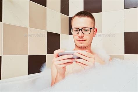 Man Using Mobile Phone In The Bathroom Mobile Phone Used Mobile Phones Man