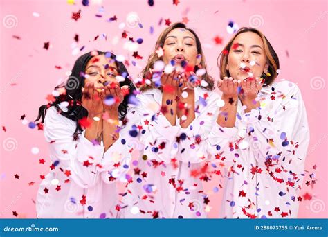 Blow Confetti And Portrait Of Women In Studio For Celebration