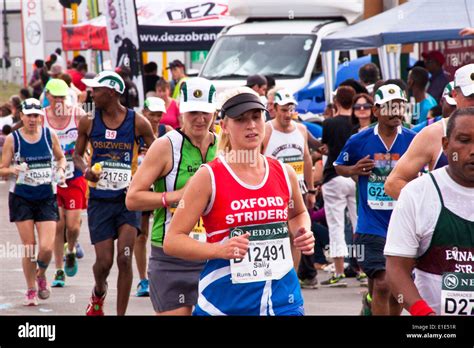 Spectators And Group Of Runners In The Long Distance Comrades Marathon