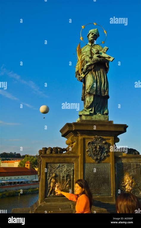 Statue Of Saint John Of Nepomuk On Charles Bridge In Central Prague