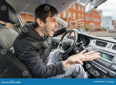 Angry Young Driver Is Driving A Car And Shouting Stock Photo Image Of