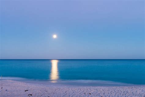 "Moonrise Over The Beach And Sunset" by Stocksy Contributor "Gillian ...