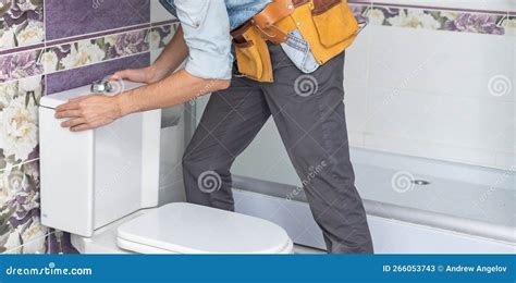 Plumber Repairing Toilet Tank in Restroom Stock Image - Image of ...