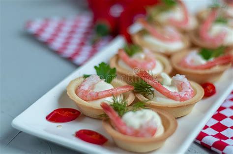 Tartlets With Cream Cheese And Shrimp Decorated With Sprigs Of Dill