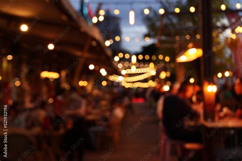 blurred image at the restaurant night time, many people in the ...